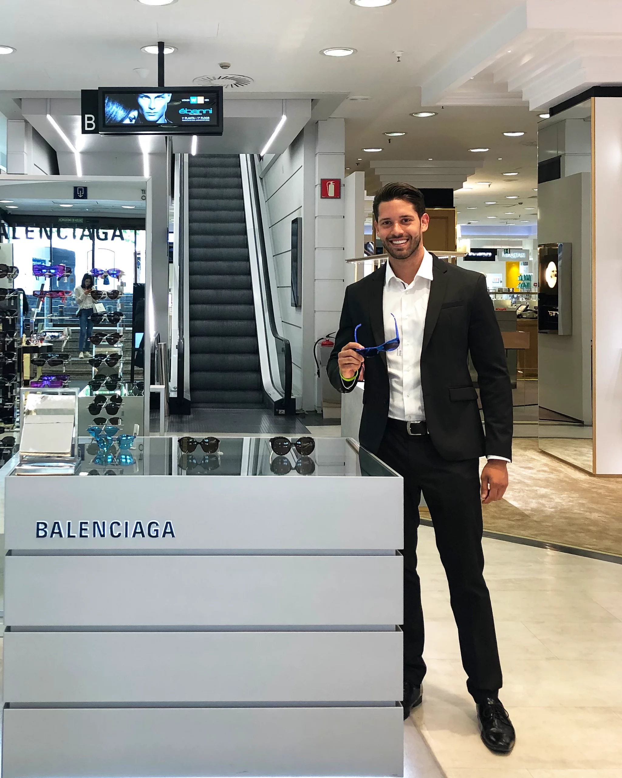 Balenciaga brand ambassador representing the brand in airport retail